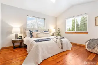 Owner's suite tucked away upstairs w/vaulted ceiling & lovely natural light