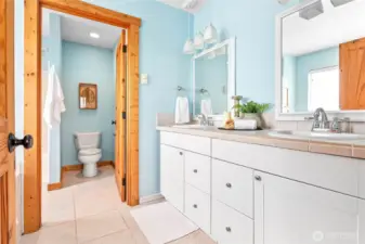 Ensuite bath w/dual vanity, separate room for shower & commode
