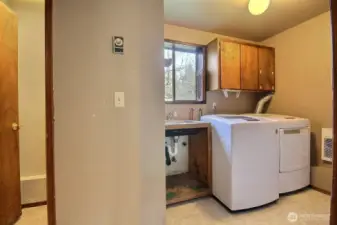 Laundry with utility sink. Washer & Dryer both stay!  Washer & dryer both stay