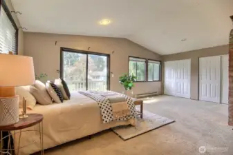 Large windows flood the home with natural light, creating a warm and inviting atmosphere.