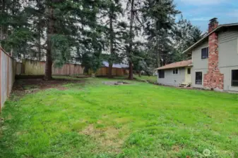 Plenty of room to garden, play, or host summer BBQs on this .27-acre private lot!