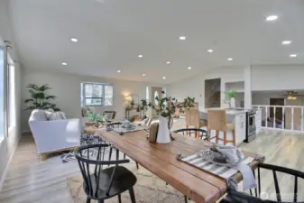 The open-concept design ensures seamless flow between kitchen, dining, and living spaces.