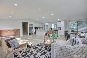 Step inside to find a beautifully updated kitchen, featuring a massive island perfect for entertaining, gleaming quartz countertops, stainless-steel appliances, and new, modern cabinetry.