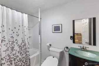 The full bath on the main level. The 2nd bathroom is access from the exterior of the home.