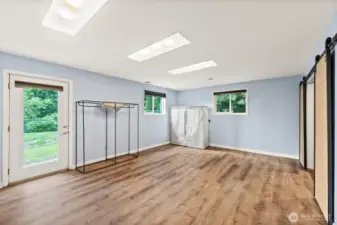 Lower Level 2nd Primary Bedroom includes ample walk closet and 4 Piece Ensuite Bathroom with 2nd walk in closet