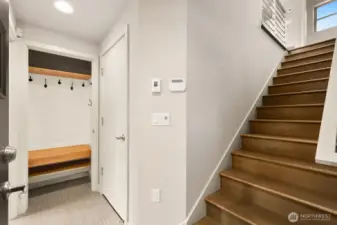Entry! Stairs lead up to the living area, door to the left of the stairs is the garage. Farther to your left is the lower level bedroom/office and full bath.