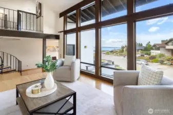 Whether you’re considering the view, filled with the wild waters of the Puget Sound and the rugged allure of the Cascade mountains, or are reveling in the company you invite into this airy space, the living room is sure to be a centering element of home life.