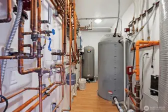 The mechanical room is very large and handles the radiant heat and well tanks.