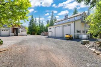 As you approach the home you will see the very large 3 bay shop, with the 30KW generator system to run the home.