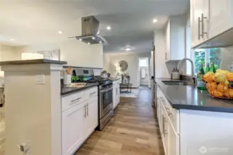 Updated kitchen with Shaker cabinets, quartz countertops and SS appliances