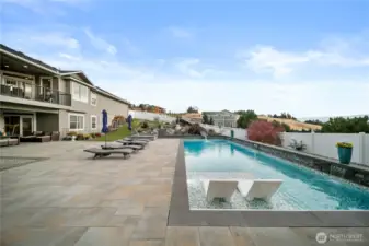 The pool features a sun-soaked Baja ledge—a shallow oasis made for lounging in the water, dipping your toes, and enjoying sunny afternoons in complete comfort