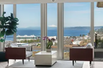 Experience elevated coastal living in this stunning one-level condo showcasing Puget Sound and mountain views. Thoughtfully designed with modern elegance, with tastefully done updates—wide-plank hardwoods, quartz counters, euro cabinetry, stainless appliances, and electronic blinds. The chef’s kitchen and eating bar and open layout creates effortless flow for entertaining. Retreat to the luxurious primary suite with a gorgeous bathroom and walk-in closet. Beautiful 2nd bedroom with a walk-in closet. Additional modern style full bath. Enjoy upscale amenities—rooftop terrace featuring panoramic views, BBQ, owners’ lounge, gym, and two parking spaces and storage unit. Minutes to charming downtown Edmonds, the waterfront, ferries and much more!