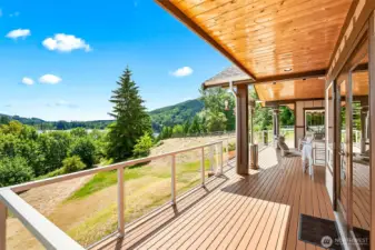 covered deck with panoramic views of lake mcmurray and the mountains