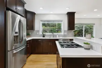 Grown your own herbs in the garden window with serene backyard views.