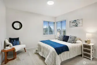 Fourth upstairs bedroom with wrap-around windows.