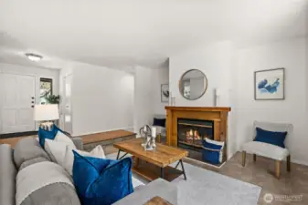 Step inside to find refinished hardwood floors and brand-new carpet throughout, creating a warm and inviting atmosphere