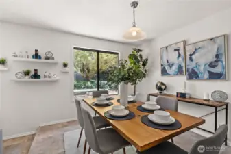 The dining room is a segue to the kitchen - and quite spacious.