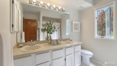 The upstairs full hall bath has 2 sinks and a special countertop.
