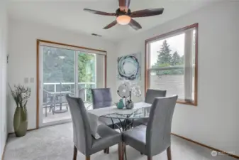 Dining room with slider to lovely view deck.