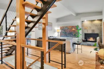 Gorgeous open staircase with hardwood flooring