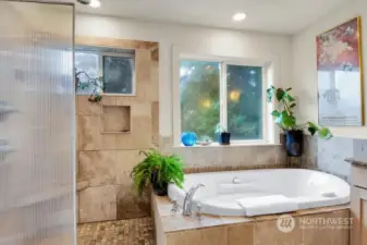 Primary bath with heated floors, soaking tub and private toilet