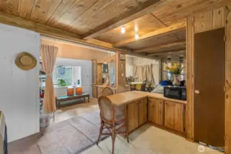 Kitchen looking out at dining room and additional areas