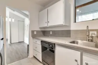 Remodeled kitchen, New granite countertops, and tile flooring.