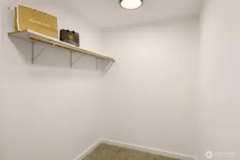 Primary bedroom walk in closet.