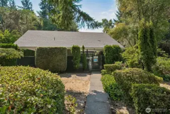 A one minute walk along a the trail in back of the home to the community outdoor pool area with bathrooms.  A portion of the area are covered and feature picnic table and chairs.
