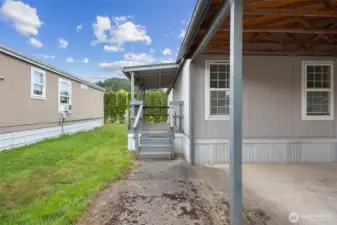 Back door entry to the kitchen/utility room side.