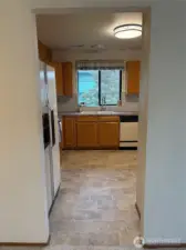 View into kitchen from bar space/hall.