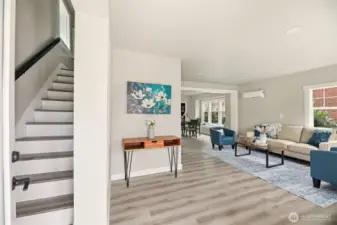 Beautiful lvp flooring throughout greets you as you enter the open concept home with a large living space.