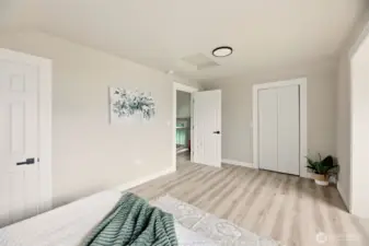 The door on the left leads to en suite bathroom and closet door on the other side of the room.