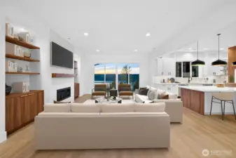 Large living room seemlislsy flows from both formal dinning room and the kitchen.