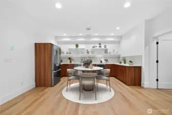 Spacious open rec room with a full kitchenette on the daylight basement level. Enjoy sweeping Lake Sammamish views throughout the lower level, the convenience of a third fridge, and the flexibility to explore expanding the kitchenette into a full kitchen with a stove, subject to city approvals.