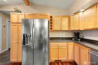 Kitchen provides generous counter sapce and storage options. Custom cabinets with lazy susans and other surprises. Top quality newer applinaces.