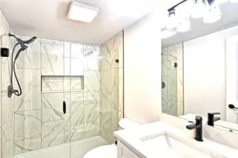 Custom primary bathroom with upscale full tile shower enclosure, glass door, all new fixtures