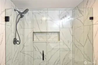Close up of the primary bathroom shower and enclosure