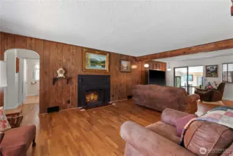 Original hardwood flooring and wood burning fireplace