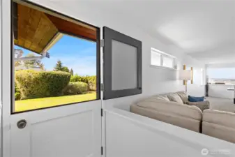 Dutch door with obscure glass leads to back deck