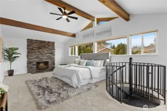 Primary bedroom w/ vaulted wood beam ceilings