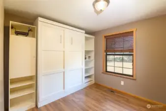 Fold the Murphy bed up like this, and you have a large office area. (Note: this is the same room)