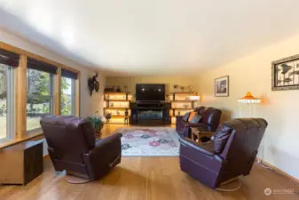 The Living room is spacious. Electric Fireplace is freestanding. Shelves and fireplace are negotiable. Front windows were recently upgrades to new top-quality Anderson wood-wrapped windows.