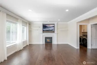 Living Room with fireplace and mounted TV