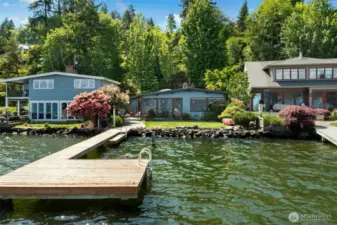 Charming mid-century modern home with 50 feet of prime waterfrontage on sought-after Rivieria Place!