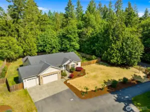 Enjoy .53+/- acres of quiet living on one level on Olympia's desirable west side