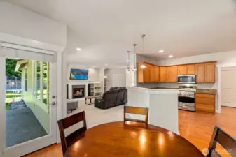 Informal dining off of the kitchen with a glass door leading to the rear patio