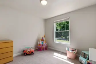 Bedroom number two at the front of the house is being used as a play room
