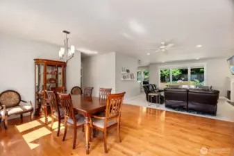 Wide open floor plan welcomes you with warm hardwood flooring in the generously sized dining room. Everything is light and bright.