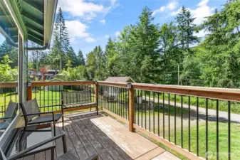 Front deck offers a bird's eye view over the green spaces that Glenhaven offers. This new deck is a great space for morning coffee and listening to the birds in the trees.